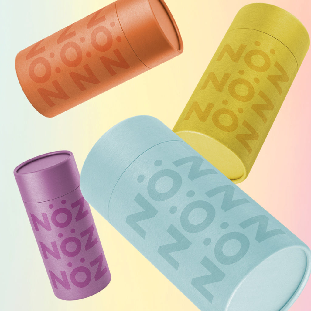 Yellow, orange, purple, and blue sunscreen bottles with Noz spelt on them. 